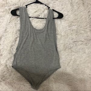 Body suit with low cut arm holes